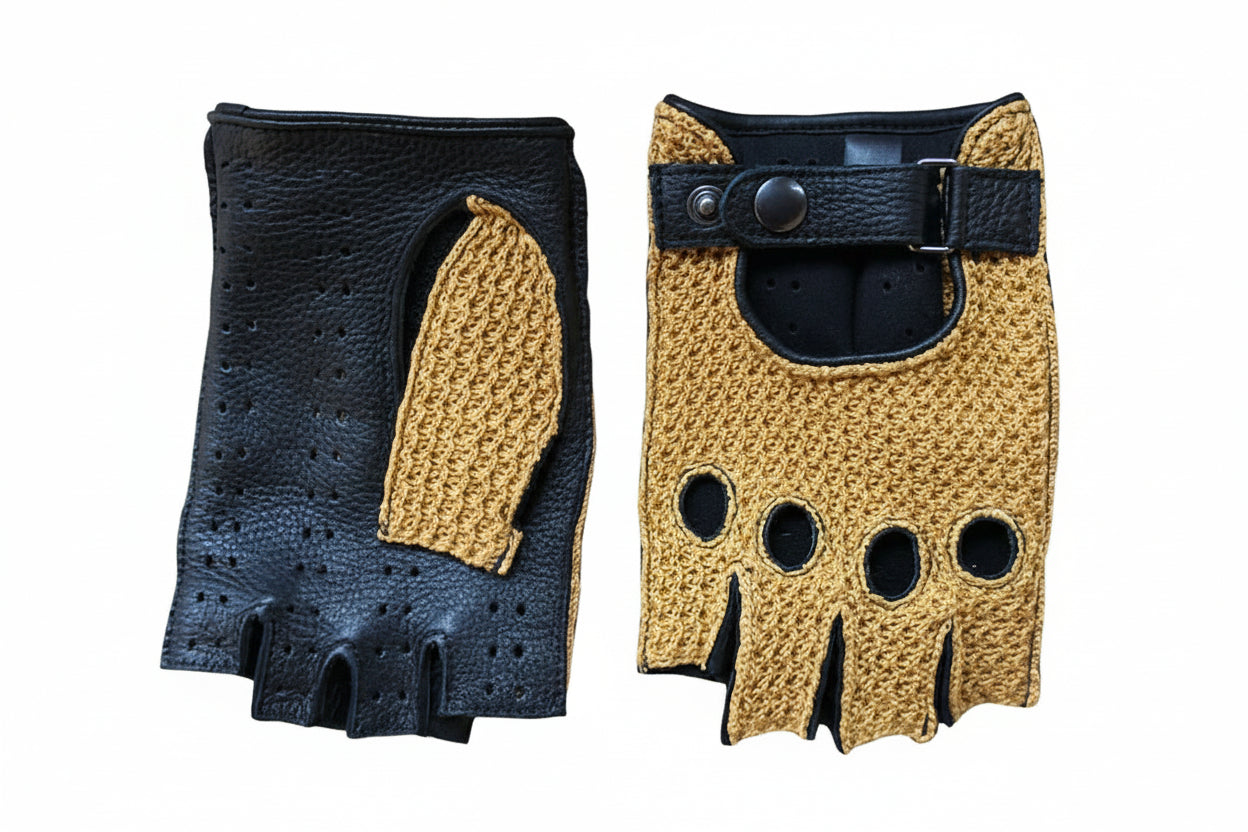 Pair of black and mustard yellow gloves on a textured surface